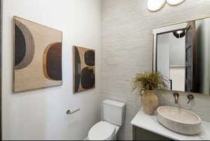 Bathroom featuring toilet and vanity