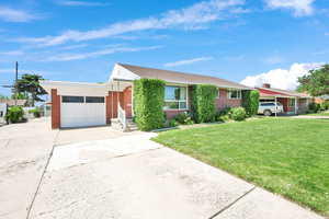 Brick Rambler with 1-car garage and ample additional parking