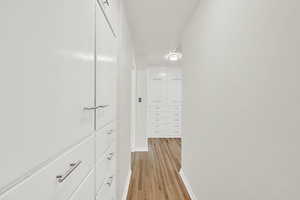 Hallway to 3 upstairs bedrooms, full bathroom, and SO much storage!
