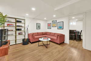 Basement living room that opens to the dining and new basement kitchen