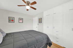 Bedroom 3 upstairs with hardwood floors and large built-in closet