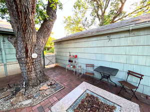 View of patio with a gate