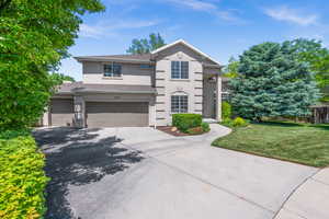 View of front of house  and an attached 3 car garage.