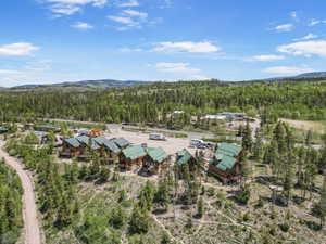 View of property location with a forest and a mountain backdrop