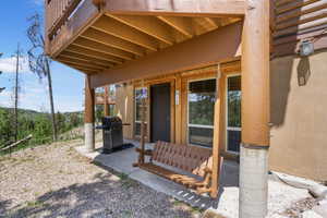 View of patio featuring a grill