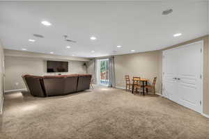 Living room featuring recessed lighting, carpet flooring, and baseboards