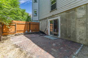 View of patio with a gate