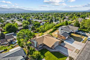 Aerial view of residential area featuring a mountain backdrop