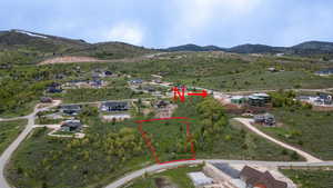 View of property location with property parcel outlined and a mountainous background