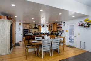 Dining room featuring recessed lighting and light wood-style floors