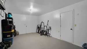 View of storage area behind garage
