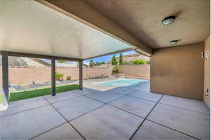 Fenced backyard featuring a patio area
