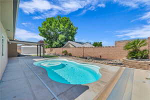 View of pool featuring a patio area and a fenced backyard