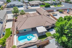 Aerial perspective of suburban area with a pool