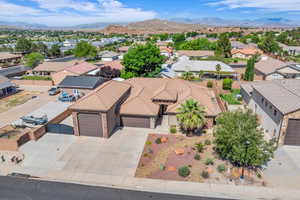 Aerial perspective of suburban area with a mountain backdrop