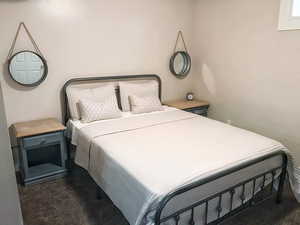 Bedroom with dark carpet