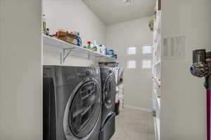 Laundry area featuring independent washer and dryer