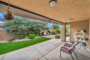 Fenced backyard featuring a patio