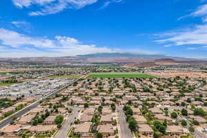 Aerial perspective of suburban area with a mountain backdrop