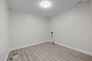 Unfurnished bonus/storage room with LVP flooring