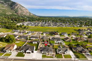 Aerial view of neighborhood with mountain backdrop