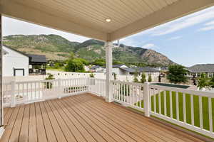 Covered Trex deck featuring a mountain view