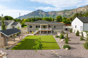 Aerial view of backyard with mountain backdrop