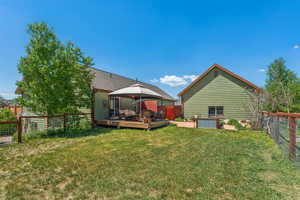 Rear view of property featuring a gazebo and a deck