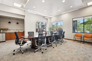 Office space featuring light carpet, recessed lighting, and baseboards