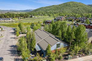 Aerial view of residential area featuring a mountainous background