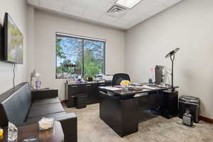 Office area featuring a paneled ceiling