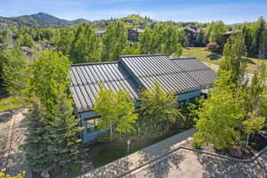 View from above of property with a mountain backdrop