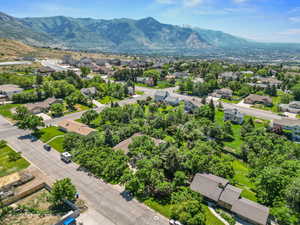 Aerial view of residential area featuring a mountainous background