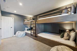 Carpeted bedroom featuring recessed lighting