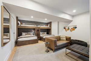 Bedroom with wood finished floors and recessed lighting