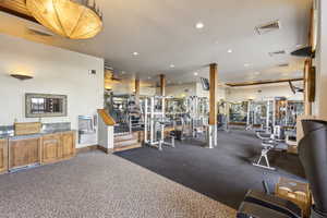 Exercise room featuring recessed lighting
