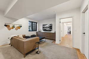 Living room with light wood finished floors and baseboards