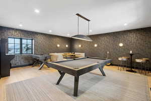 Game room featuring wood finished floors and billiards table