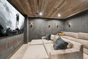 Home theater room featuring wood ceiling and recessed lighting