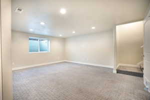 Basement with recessed lighting, carpet flooring, and baseboards