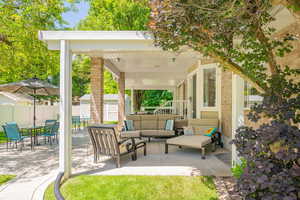 View of patio with an outdoor hangout area and outdoor dining area