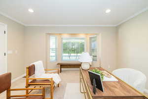 Office space with crown molding, light carpet, recessed lighting, and baseboards