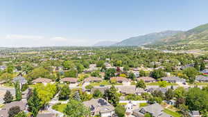 Aerial view of residential area featuring mountains