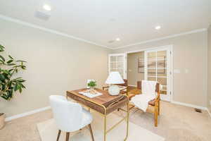 Home office featuring light carpet, baseboards, crown molding, and recessed lighting