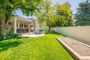 View of yard with a patio area