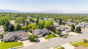 Aerial view of residential area featuring a mountainous background