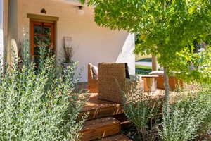 Entrance to property featuring stucco siding