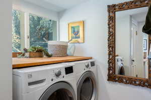 Washroom featuring washer and clothes dryer