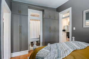 Bedroom with a closet and light wood-style floors
