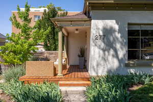 Doorway to property with stucco siding
